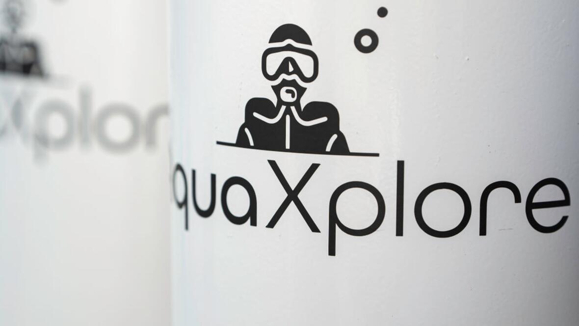 Das Logo von AquaXplore steht für Leidenschaft, Sicherheit und Kompetenz im Tauchsport – sichtbar auf jedem Detail der Ausrüstung.